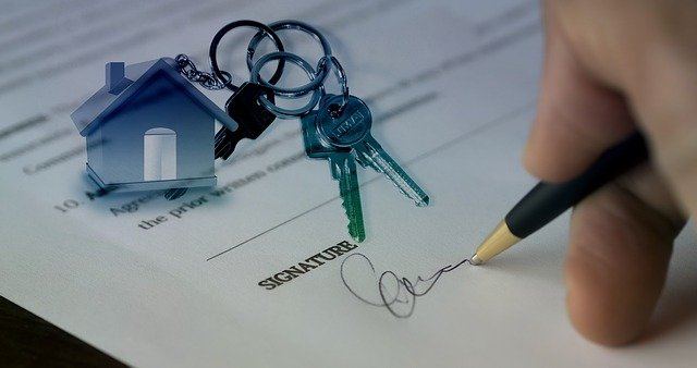 signing a mortgage document